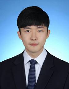 A young person wearing a suit and tie  Description automatically generated